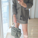 Sage green suit with gold details